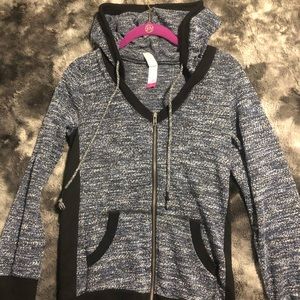 Blue, black, and white zip up jacket